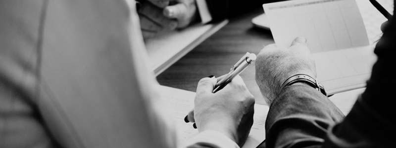 Hands signing divorce document