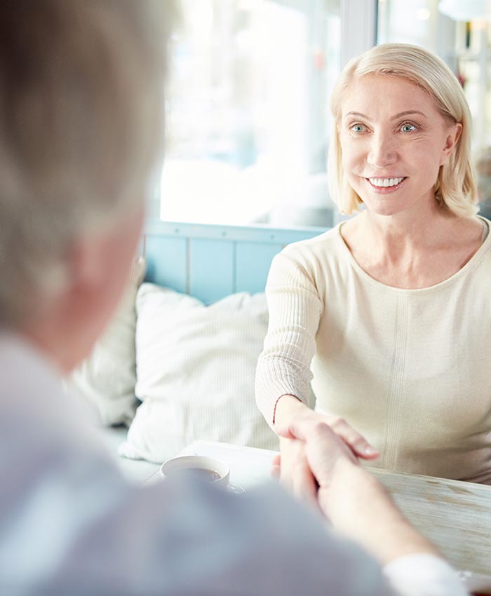 Parents shaking hands while reaching an agreement on their parenting plan