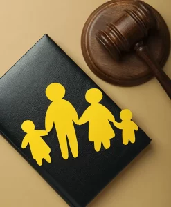 gavel and documents aside from a yellow paper cut family