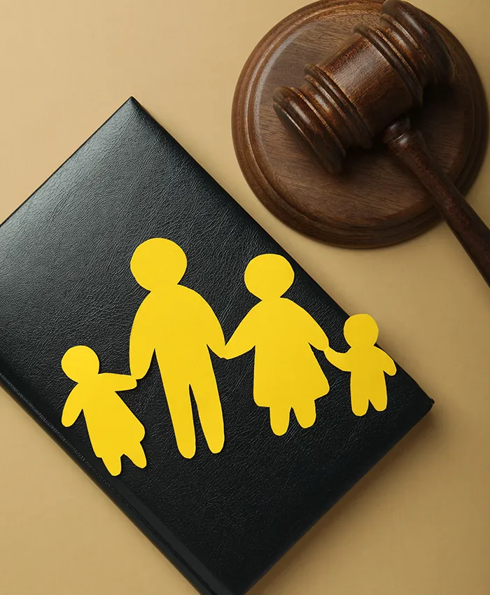 gavel and documents aside from a yellow paper cut family